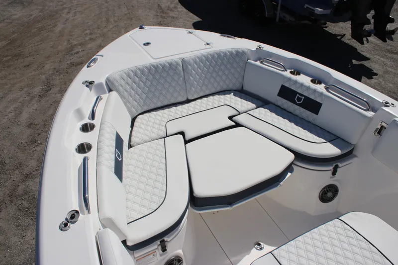 Slide: The Image of Luxurious seating on 2026 Sea Fox 268 Commander boat, featuring quilted upholstery and cup holders. - 10