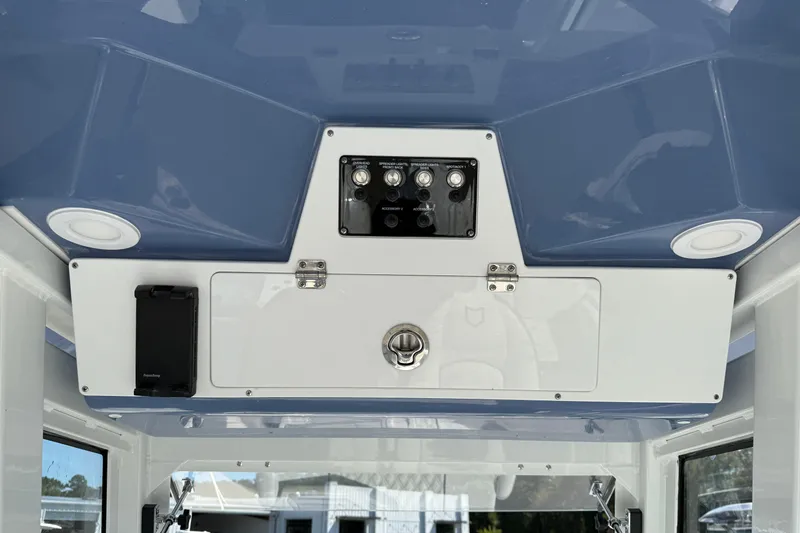 Slide: The Image of 2026 Sea Fox 268 Commander boat interior with control panel and storage compartment. - 21
