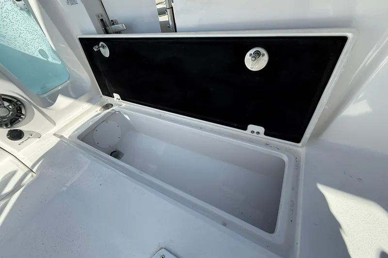 Slide: The Image of Open storage compartment on 2026 Sea Fox 268 Commander boat deck. - 23