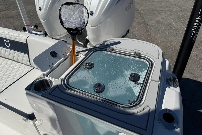 Slide: The Image of 2026 Sea Fox 268 Commander boat with livewell and fishing net on deck. - 24