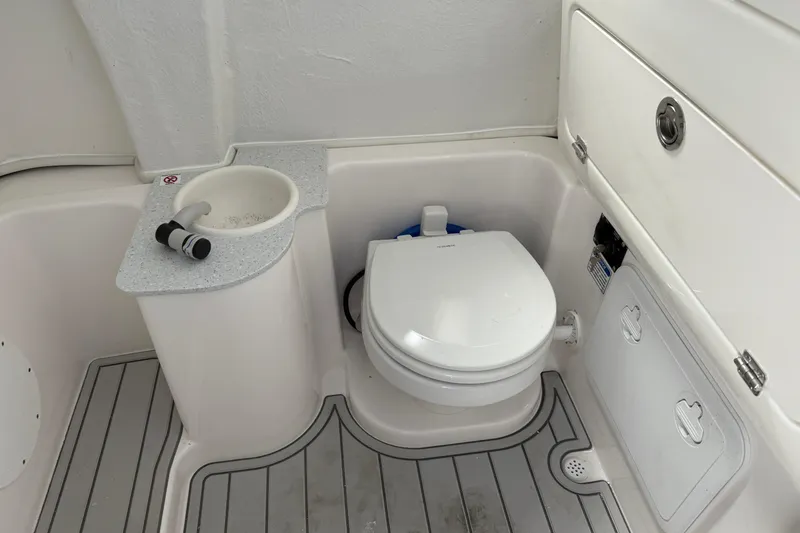 Slide: The Image of 2026 Sea Fox 268 Commander boat bathroom with toilet and sink. - 26