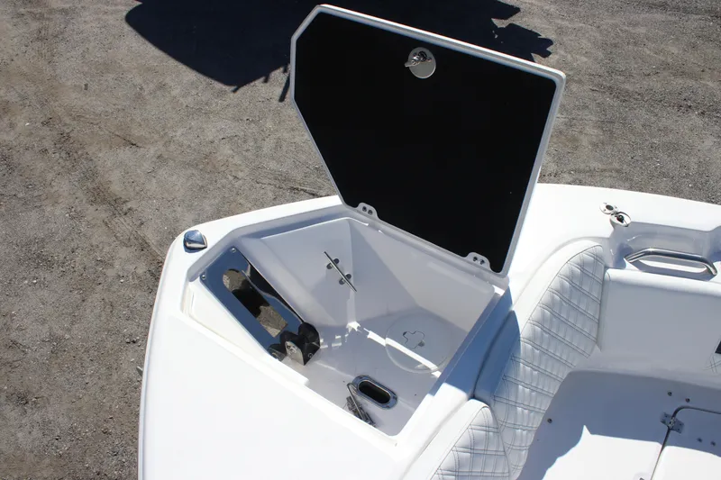 Slide: The Image of Open storage compartment on 2026 Sea Fox 268 Commander boat, featuring quilted seating. - 7