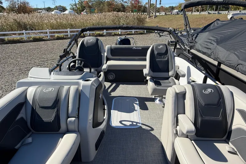 Slide: The Image of 2026 Barletta C24UC pontoon boat interior with luxurious seating and modern design. - 2