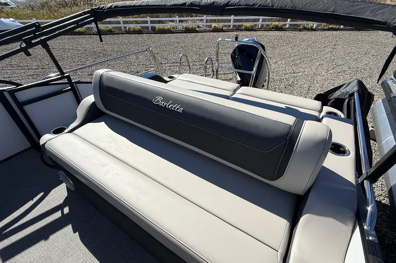 Slide: The Image of 2026 Barletta C24UC boat interior with comfortable seating and elegant design. - 4