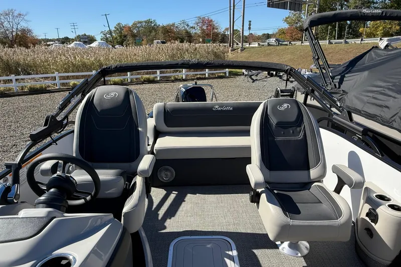 Slide: The Image of 2026 Barletta C24UC boat interior with plush seating and modern design. - 6