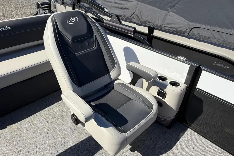 Slide: The Image of 2026 Barletta C24UC boat seat with armrests and cup holders. - 8