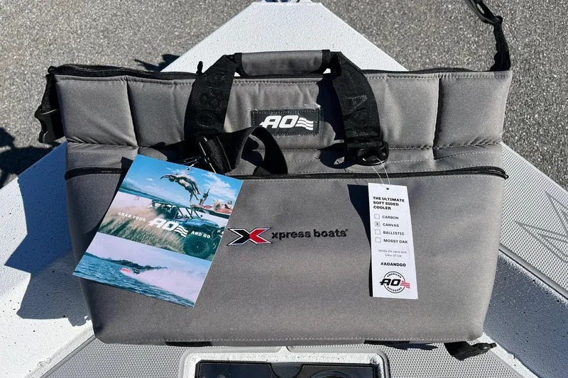 Slide: The Image of Soft-sided cooler on Express H18C Crappie boat, showcasing AO branding and promotional materials. - 21