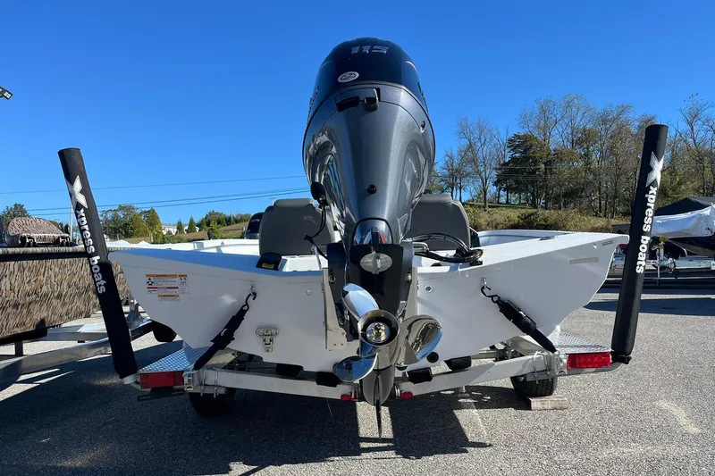 Slide: The Image of 2026 Express H18C Crappie boat with Yamaha Vmax 115 SHO engine, parked outdoors. - 4