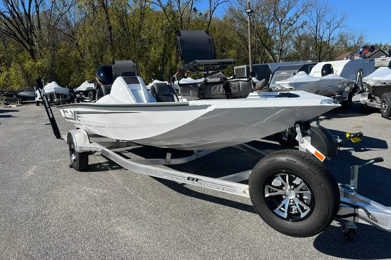 Slide: The Image of 2026 Express H18C Crappie boat with Yamaha Vmax 115 SHO, parked on a trailer. - 6