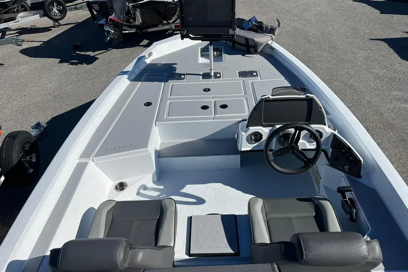 Slide: The Image of 2026 Express H18C Crappie boat interior with Yamaha Vmax 115 SHO, featuring modern controls. - 7
