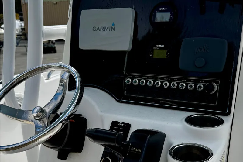 Slide: The Image of 2016 Tidewater 232 CC Adventure boat dashboard with Garmin and Yamaha controls. - 11
