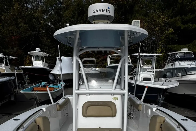 Slide: The Image of 2016 Tidewater 232 CC Adventure boat with Garmin equipment, surrounded by other boats. - 12