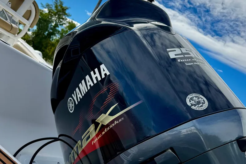 Slide: The Image of Yamaha outboard motor on 2016 Tidewater 232 CC Adventure boat under blue sky. - 9