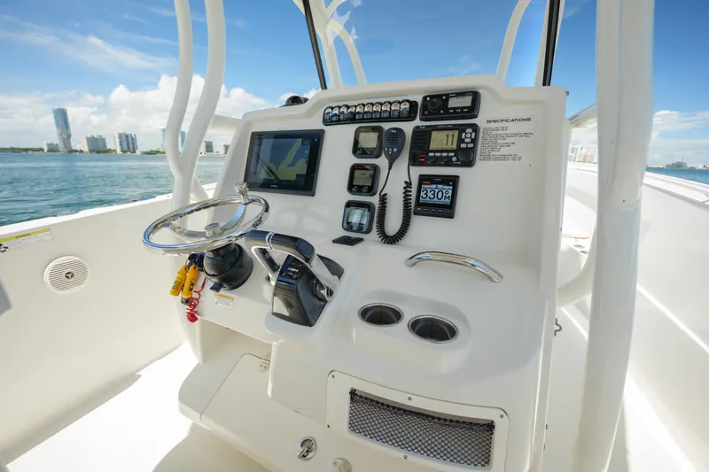 Slide: The Image of Control panel of a 2015 Sailfish 320 CC boat with navigation instruments. - 14