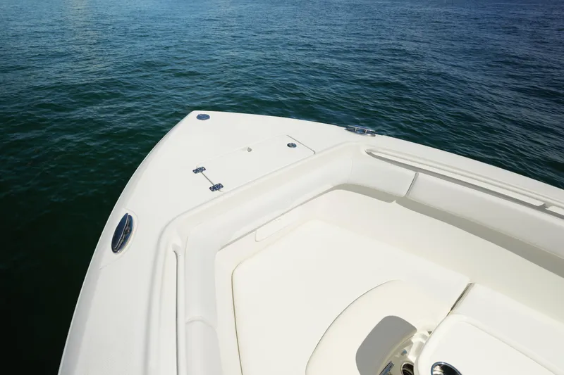 Slide: The Image of Bow of 2015 Sailfish 320 CC boat on calm water. - 8