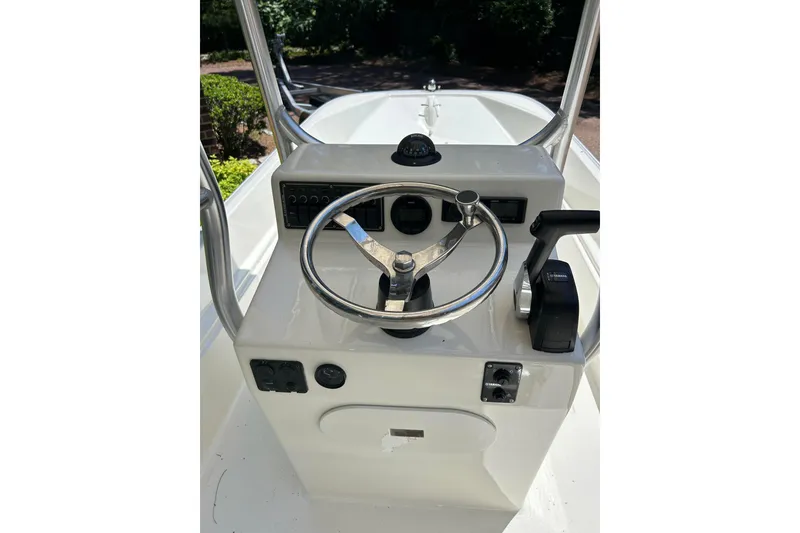 Slide: The Image of 1978 Boston Whaler 17 Montauk boat console with steering wheel and controls. - 3