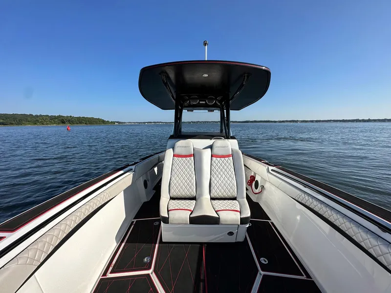 Slide: The Image of 2017 Statement 380 Open boat on calm water, featuring sleek seating and modern design. - 11