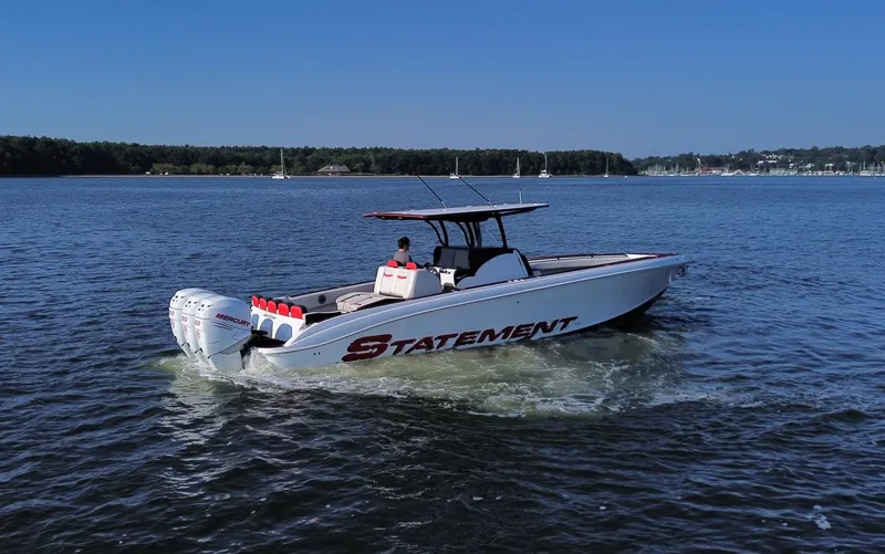 Slide: The Image of 2017 Statement 380 Open boat cruising on a calm lake. - 24