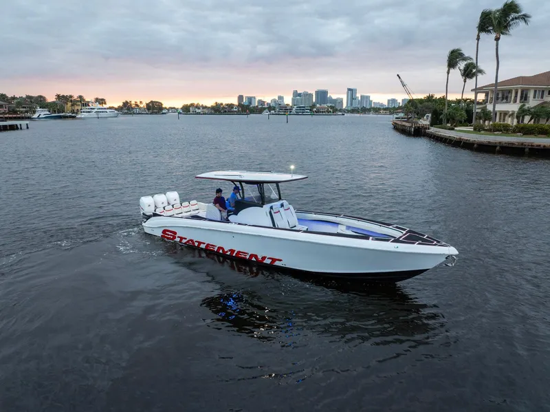 Slide: The Image of 2017 Statement 380 Open boat cruising on a scenic waterway at sunset. - 28