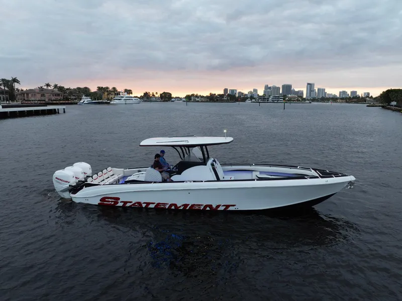 Slide: The Image of Statement 380 Open 2017 boat on water with city skyline in background. - 3
