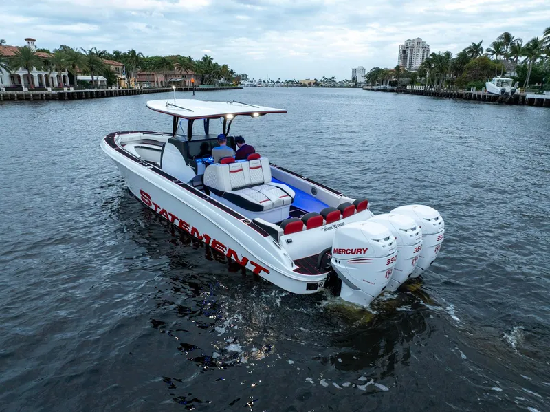 Slide: The Image of 2017 Statement 380 Open boat cruising on a scenic waterway with powerful Mercury engines. - 37