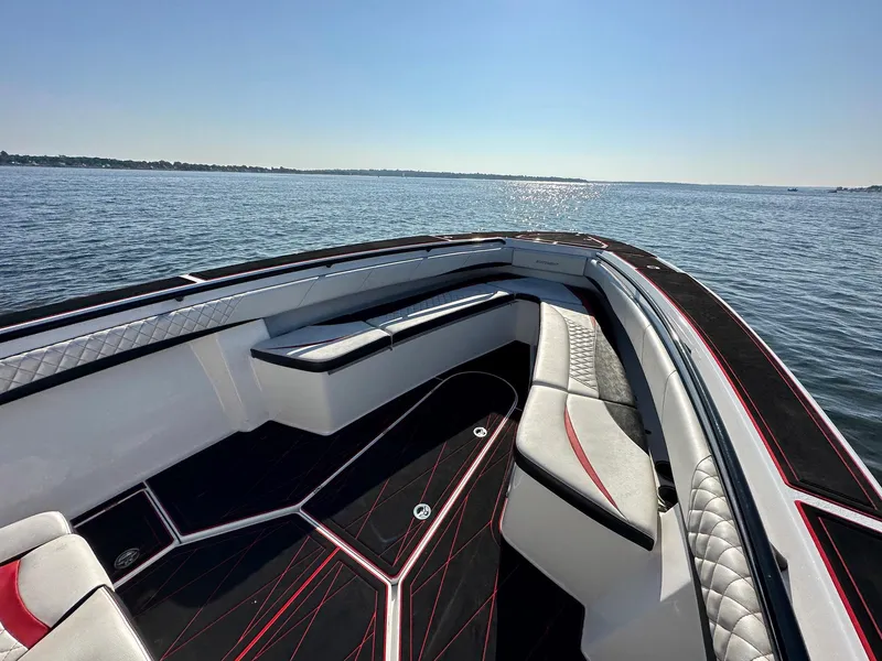 Slide: The Image of Luxurious 2017 Statement 380 Open boat interior with sleek seating on open water. - 7