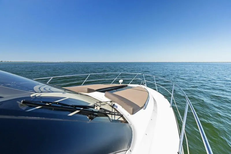 Slide: The Image of 2017 Galeon 385 HTS yacht cruising on open water under clear blue sky. - 14