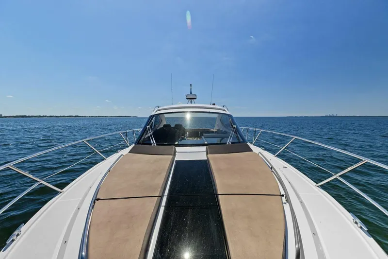 Slide: The Image of 2017 Galeon 385 HTS yacht cruising on open water under clear blue sky. - 15