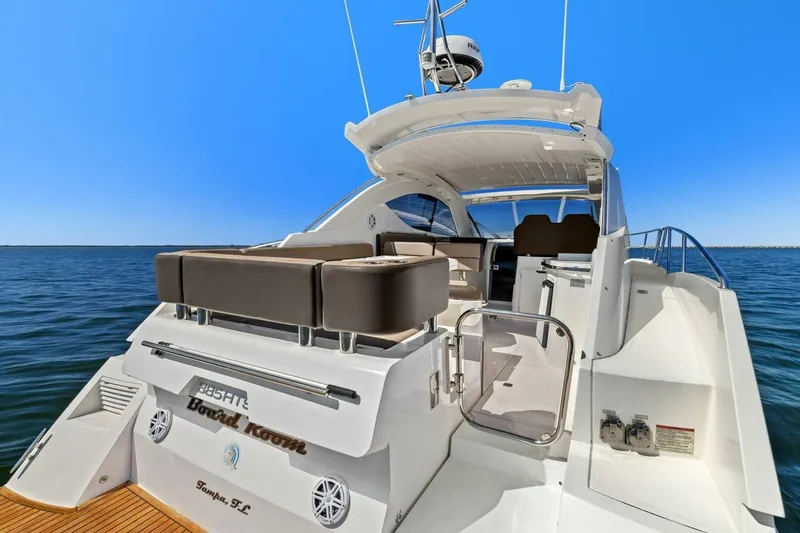 Slide: The Image of 2017 Galeon 385 HTS yacht with spacious deck, cruising on open water. - 17