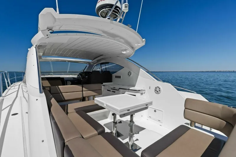 Slide: The Image of 2017 Galeon 385 HTS yacht with spacious seating area on open water. - 20