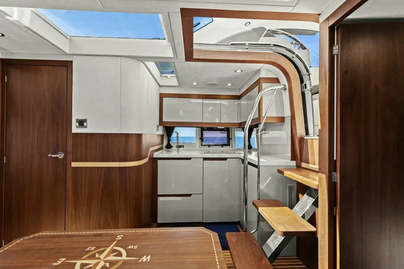 Slide: The Image of Interior of 2017 Galeon 385 HTS yacht with modern wood and white design. - 28