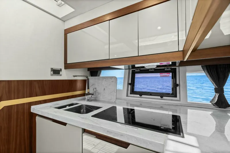 Slide: The Image of Modern kitchen interior of 2017 Galeon 385 HTS yacht with ocean view. - 32