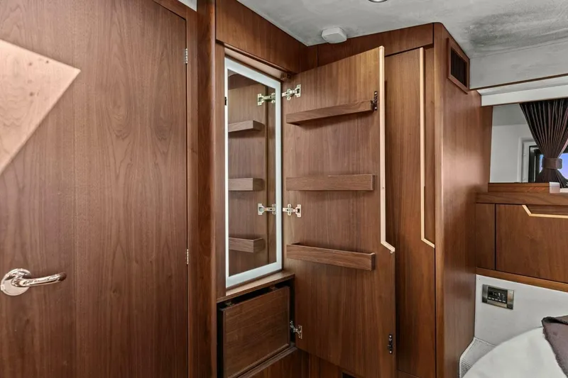 Slide: The Image of Interior of 2017 Galeon 385 HTS yacht featuring elegant wooden cabinetry and modern design. - 40