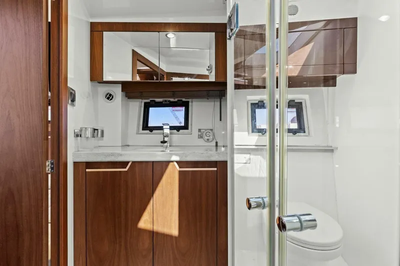 Slide: The Image of Luxurious bathroom interior of 2017 Galeon 385 HTS yacht with wood accents and modern fixtures. - 41