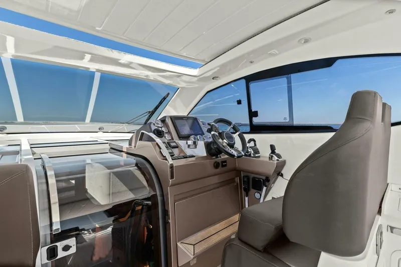 Slide: The Image of Interior of 2017 Galeon 385 HTS yacht, featuring modern helm and luxurious seating. - 53