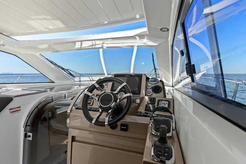 Slide: The Image of 2017 Galeon 385 HTS yacht helm with modern controls and ocean view. - 55