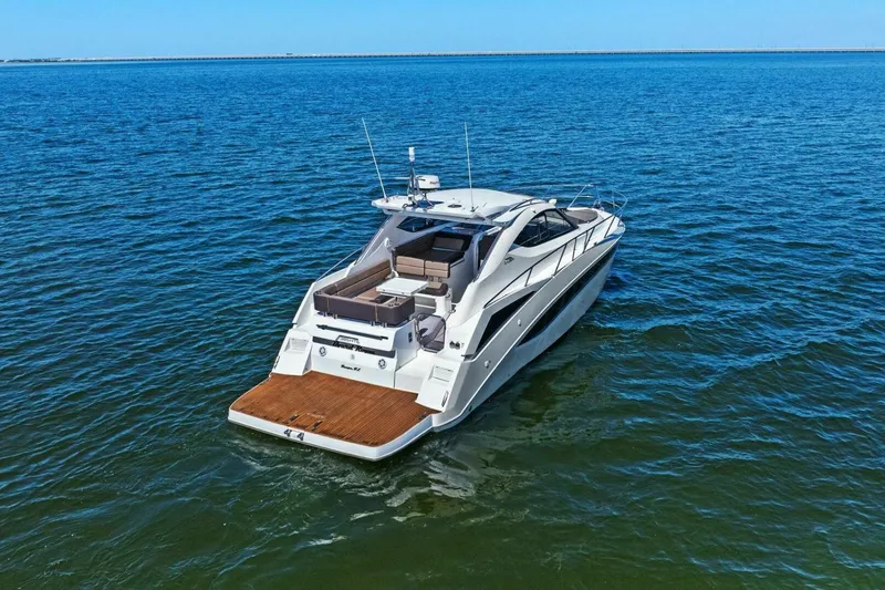 Slide: The Image of 2017 Galeon 385 HTS yacht cruising on open blue water. - 9