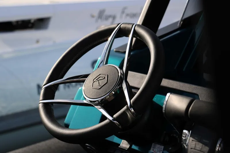 Slide: The Image of Steering wheel of 2023 Roughneck 36 T Top boat, close-up view. - 10