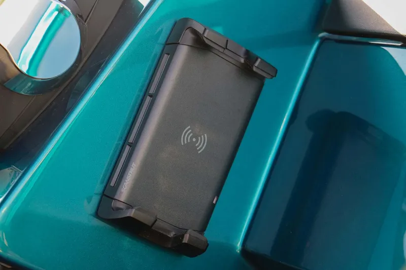 Slide: The Image of Wireless charging pad on 2023 Roughneck 36 T Top boat dashboard. - 14