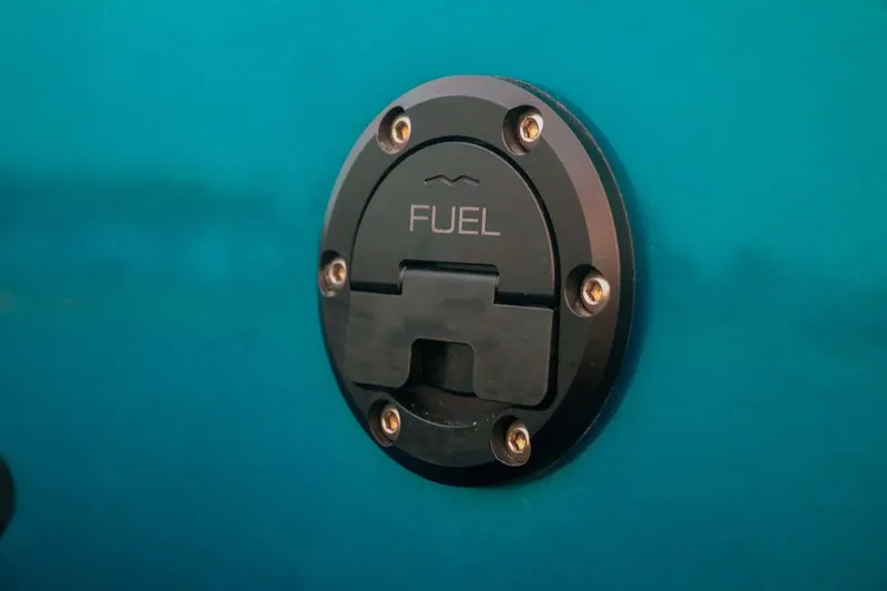 Slide: The Image of Fuel cap on 2023 Roughneck 36 T Top boat, close-up view. - 15