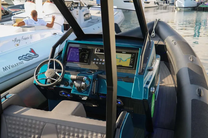 Slide: The Image of 2023 Roughneck 36 T Top boat interior with modern navigation system and steering wheel. - 17