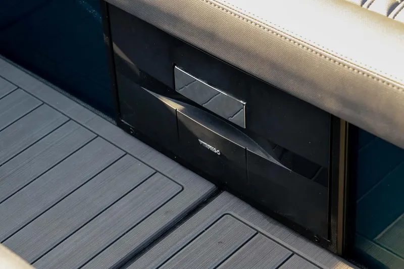 Slide: The Image of 2023 Roughneck 36 T Top boat interior with sleek, modern design and storage compartment. - 18