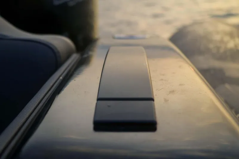 Slide: The Image of Close-up of 2023 Roughneck 36 T Top boat detail at sunset. - 21