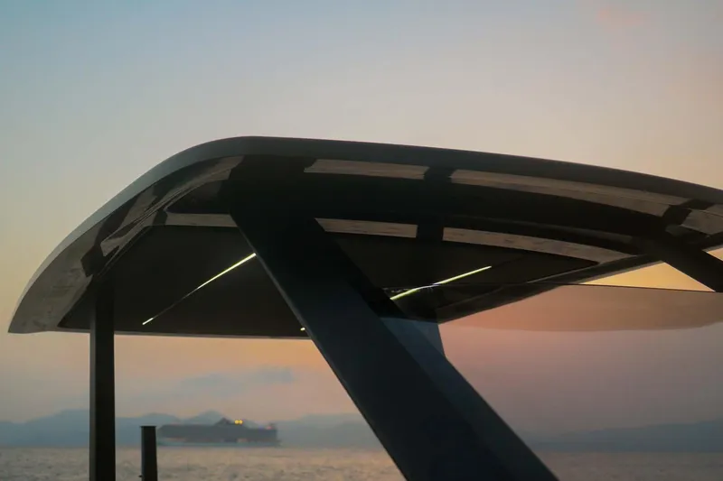 Slide: The Image of Roughneck 36 T Top 2023 boat silhouette at sunset over calm sea. - 22