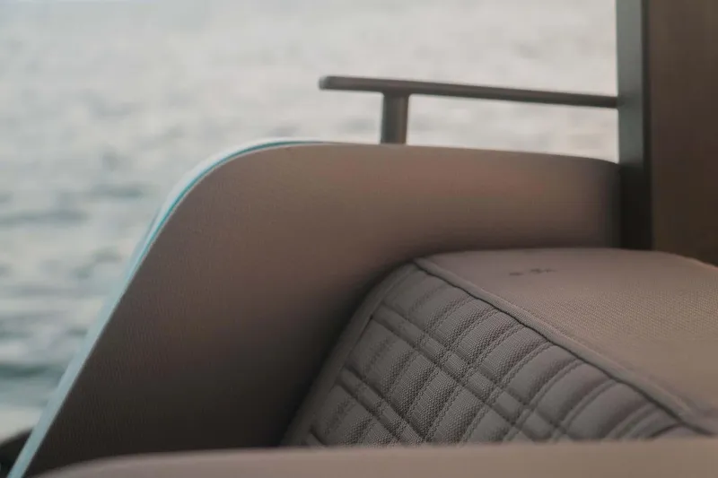 Slide: The Image of Close-up of 2023 Roughneck 36 T Top boat seating with quilted upholstery. - 26