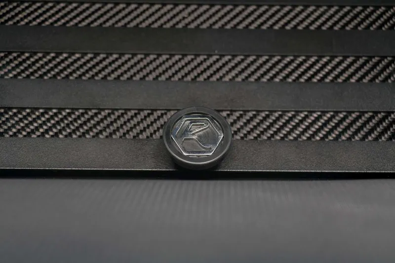 Slide: The Image of 2023 Roughneck 36 T Top logo on carbon fiber background. - 29