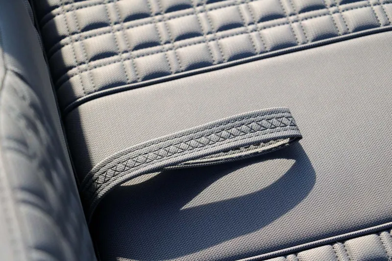 Slide: The Image of Close-up of 2023 Roughneck 36 T Top boat seat with textured fabric and strap. - 31