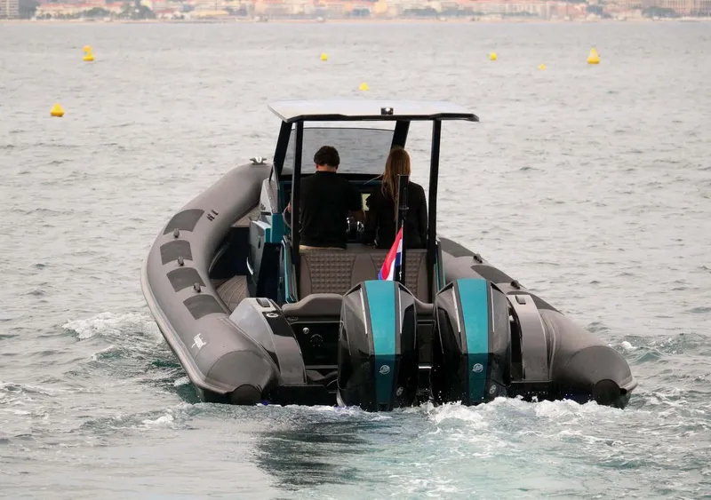 Slide: The Image of 2023 Roughneck 36 T Top boat cruising on open water, rear view. - 42