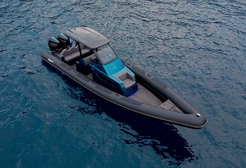 Slide: The Image of 2023 Roughneck 36 T Top boat on open water, sleek design, modern features. - 44