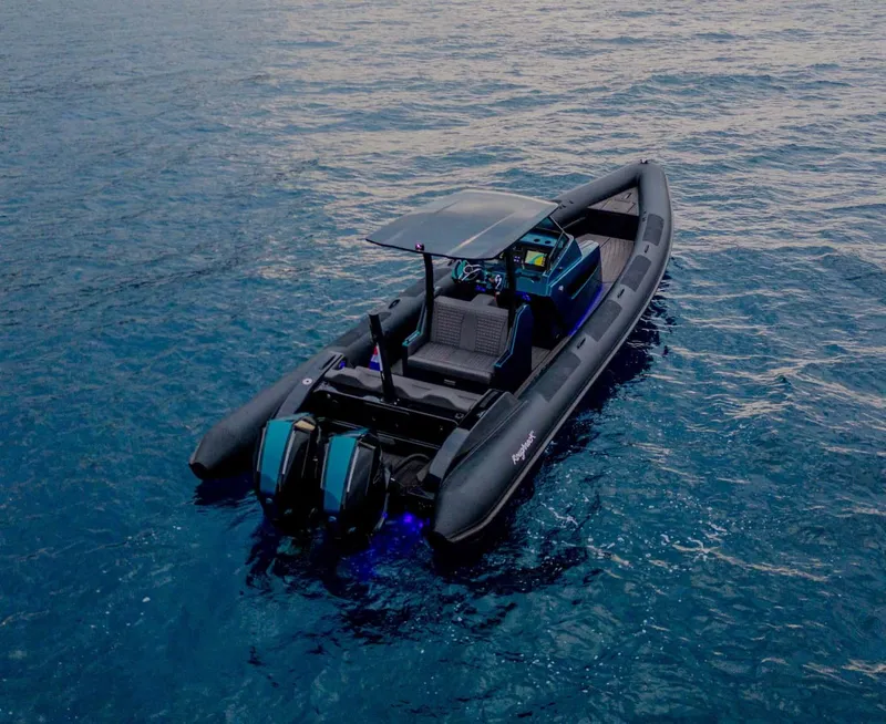 Slide: The Image of 2023 Roughneck 36 T Top boat on open water, featuring dual engines and sleek design. - 48